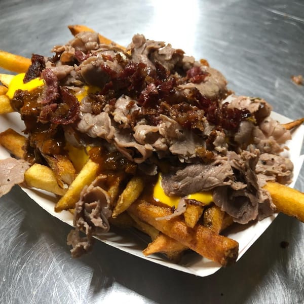 Golden fries topped with thinly sliced beef, melted cheese, and crispy bacon bits.