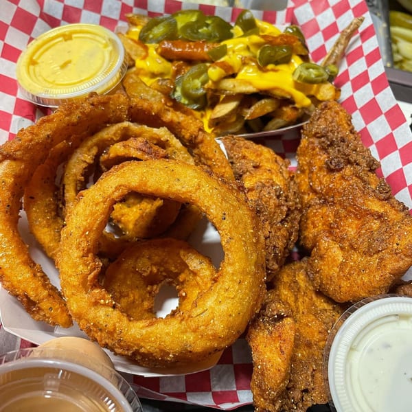 Fried chicken tenders, onion rings, and cheesy fries with jalapeños and dipping sauces.